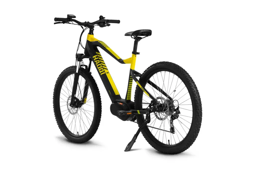 Seitenansicht eines gelben und schwarzen HAOQI Cheetah All-Terrain E-MTB mit Mittelmotor, Federgabel und Scheibenbremsen.