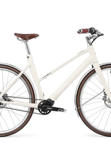 Schindelhauer Antonia E-Bike in Sahneweiß mit braunem Ledersattel und Ledergriffen, seitliche Ansicht