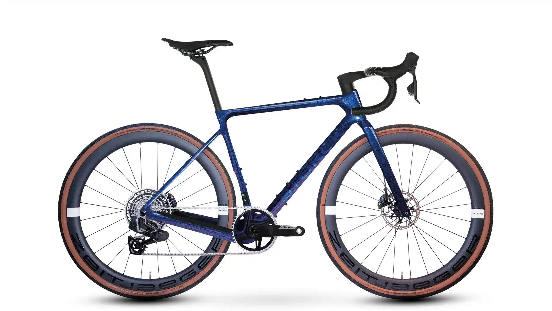 Seitenansicht eines Storck GRIX.3 Gravelbikes mit blauem Metallic-Rahmen, braunen Reifen und schwarzen Anbauteilen.