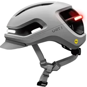 Grauer UNIT 1 AURA Mips Smart-Helm mit integriertem weißem Frontlicht und rotem Rücklicht, Mips-Logo und Belüftungsöffnungen.
