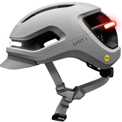Grauer UNIT 1 AURA Mips Smart-Helm mit integriertem weißem Frontlicht und rotem Rücklicht, Mips-Logo und Belüftungsöffnungen.