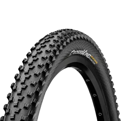 Profil und Seitenwand eines Continental Cross King ShieldWall Mountainbike-Reifens mit "PureGrip Compound" und "ShieldWall System" Beschriftung.