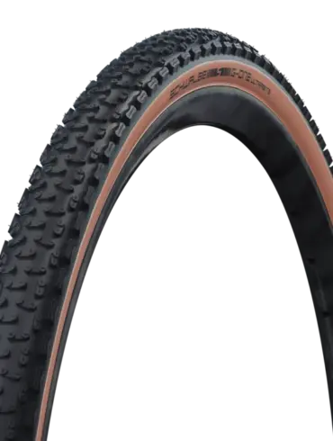 Schwalbe G-One Ultrabite Gravelreifen mit aggressivem Profil und brauner Seitenwand.