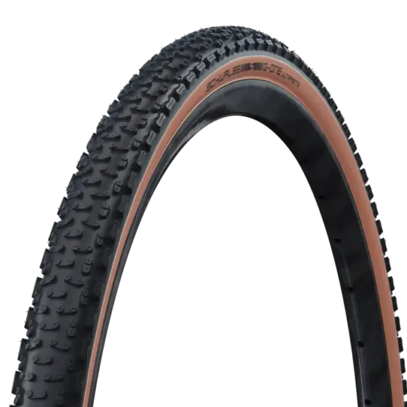 Schwalbe G-One Ultrabite Gravelreifen mit aggressivem Profil und brauner Seitenwand.
