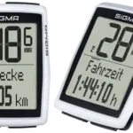 Zwei weiße SIGMA BC 12.0 WL Fahrradcomputer mit großen Displays, die Fahrinformationen wie Geschwindigkeit, Strecke und Fahrzeit anzeigen.
