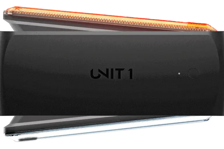 Ein schwarzes UNIT 1 Smart Light Fahrradlicht, das vorne und hinten montiert werden kann, mit integriertem Blinklicht.