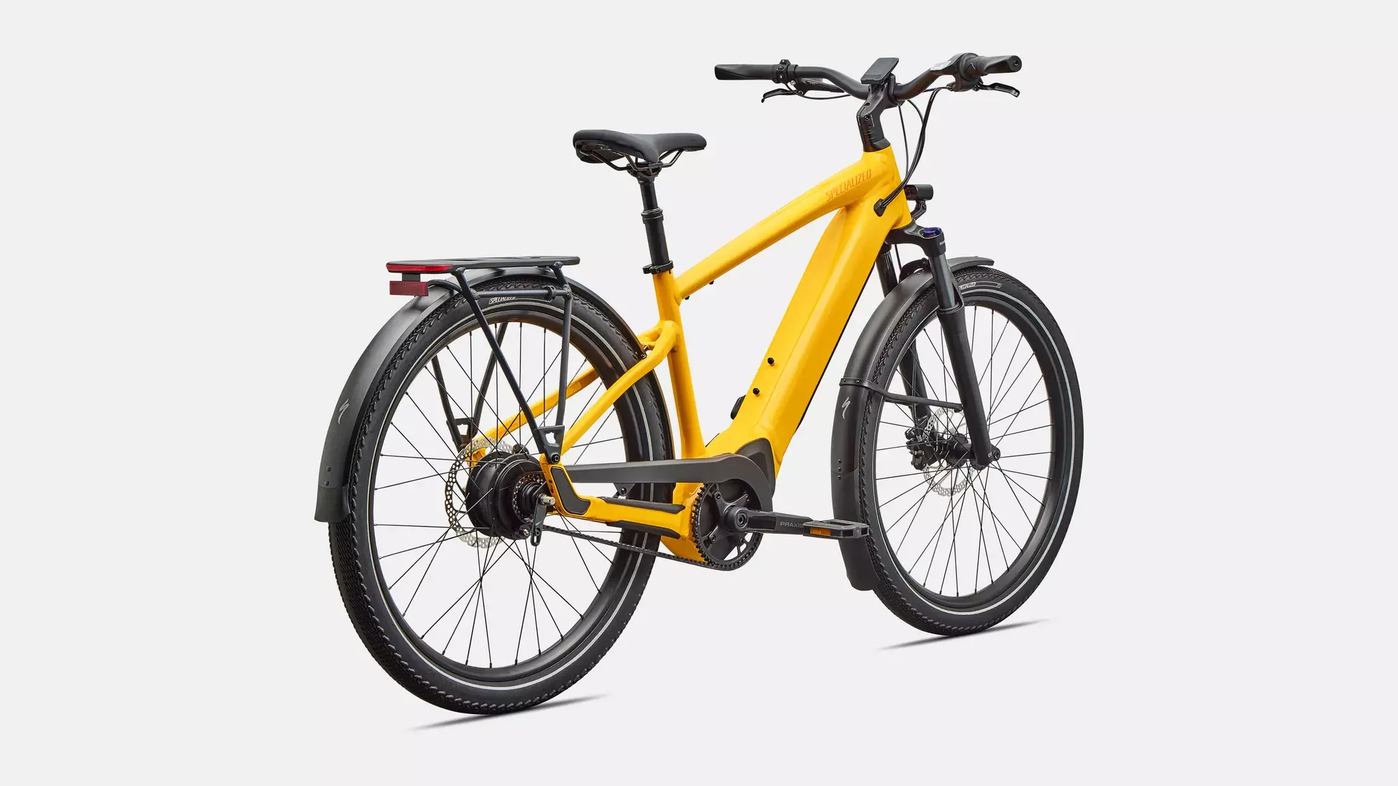 Gelbes Specialized Turbo Vado 4.0 IGH E-Bike von der Seite, mit Gepäckträger, Schutzblechen und Riemenantrieb.