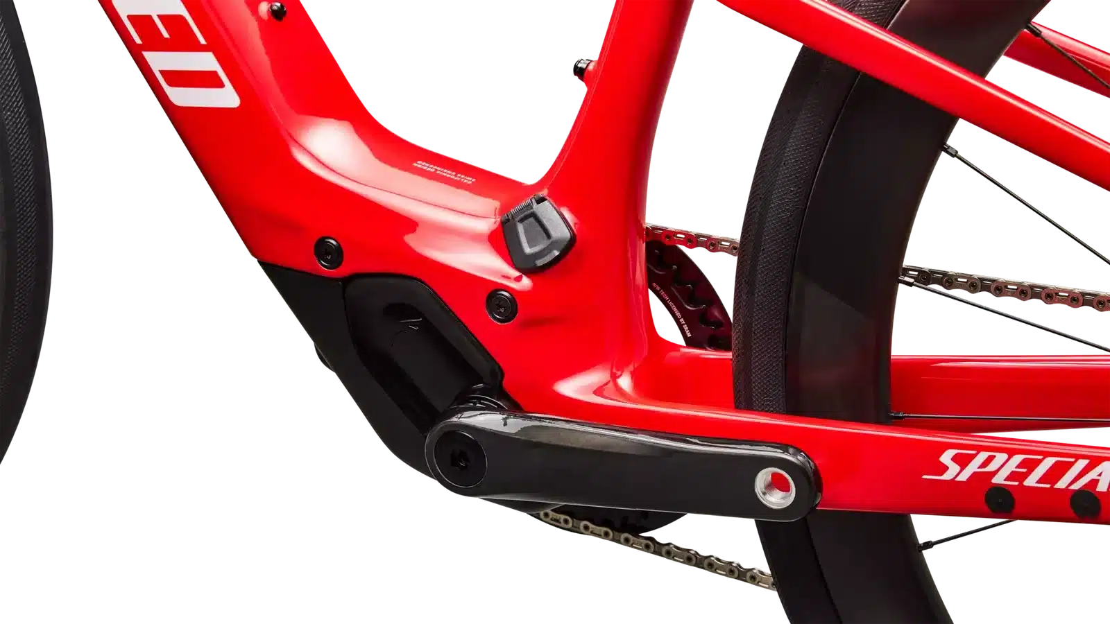 Detailaufnahme des roten E-Bikes Specialized Vado SL 2 LTD S-Racing mit Fokus auf die Kurbelgarnitur und den Antriebsstrang.
