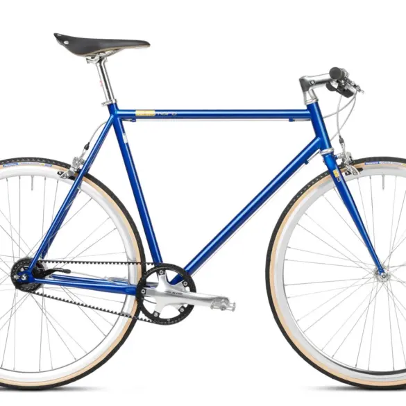 Seitenansicht eines blauen Mikamaro Anniversary Edition Urban Bikes mit hellbraunen Reifen und goldenen Logos.