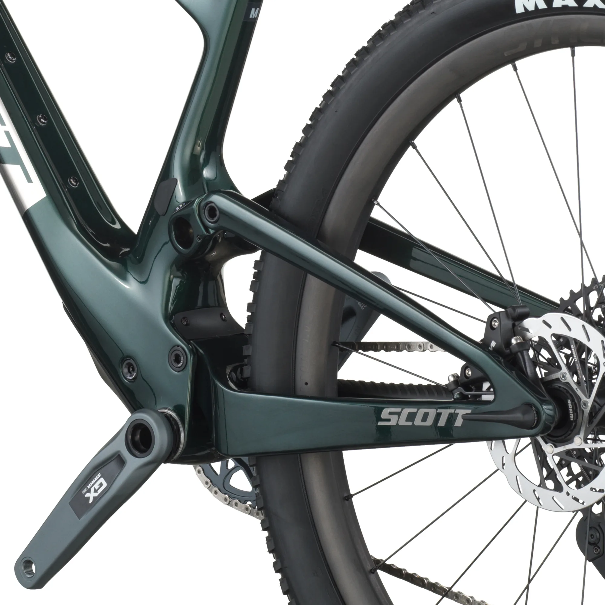 Detaillierte Ansicht des Hinterbaus eines SCOTT Spark RC Team Issue Mountainbikes mit Fokus auf den Carbonrahmen, das Federungssystem und die SRAM GX Eagle AXS Schaltung.