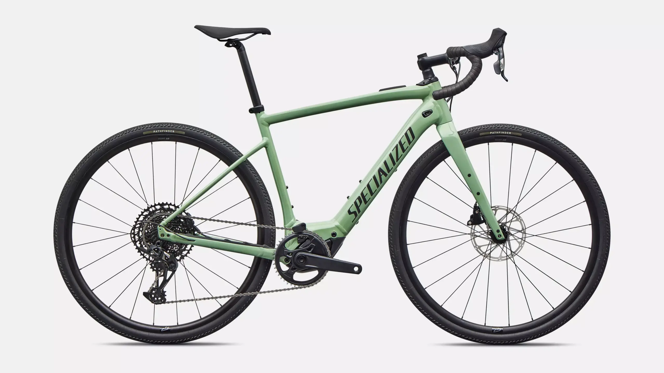 Grünes Specialized Turbo Creo 2 Comp E5 E-Rennrad mit Rennlenker und breiten Reifen, von vorne links betrachtet.