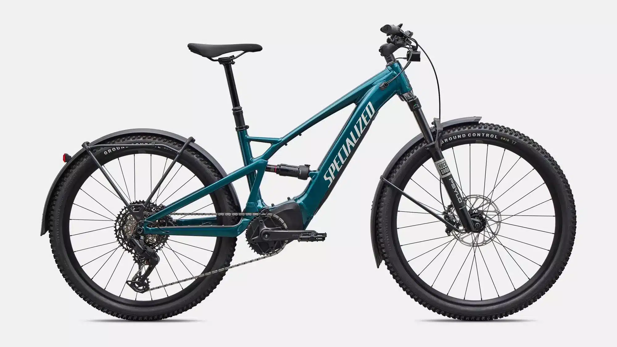 Seitenansicht eines Specialized Turbo Tero X 5.0 E-Bikes in smaragdgrüner Metallic-Lackierung mit Schutzblechen und Gepäckträger.