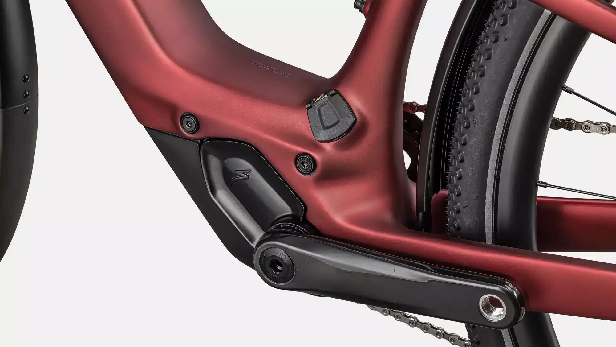 Detailaufnahme des Rahmens und der Kurbelgarnitur eines roten Specialized Turbo Vado SL 2 6.0 EQ Carbon E-Bikes.
