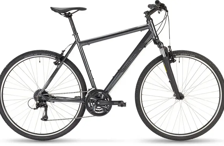 Graues Stevens 3X HT Fahrrad mit Federgabel und Schwalbe Smart Sam Reifen, von der Seite betrachtet.