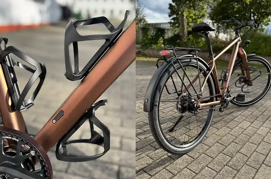 Fahrrad mit braunem Rahmen und schwarzen Anbauteilen.