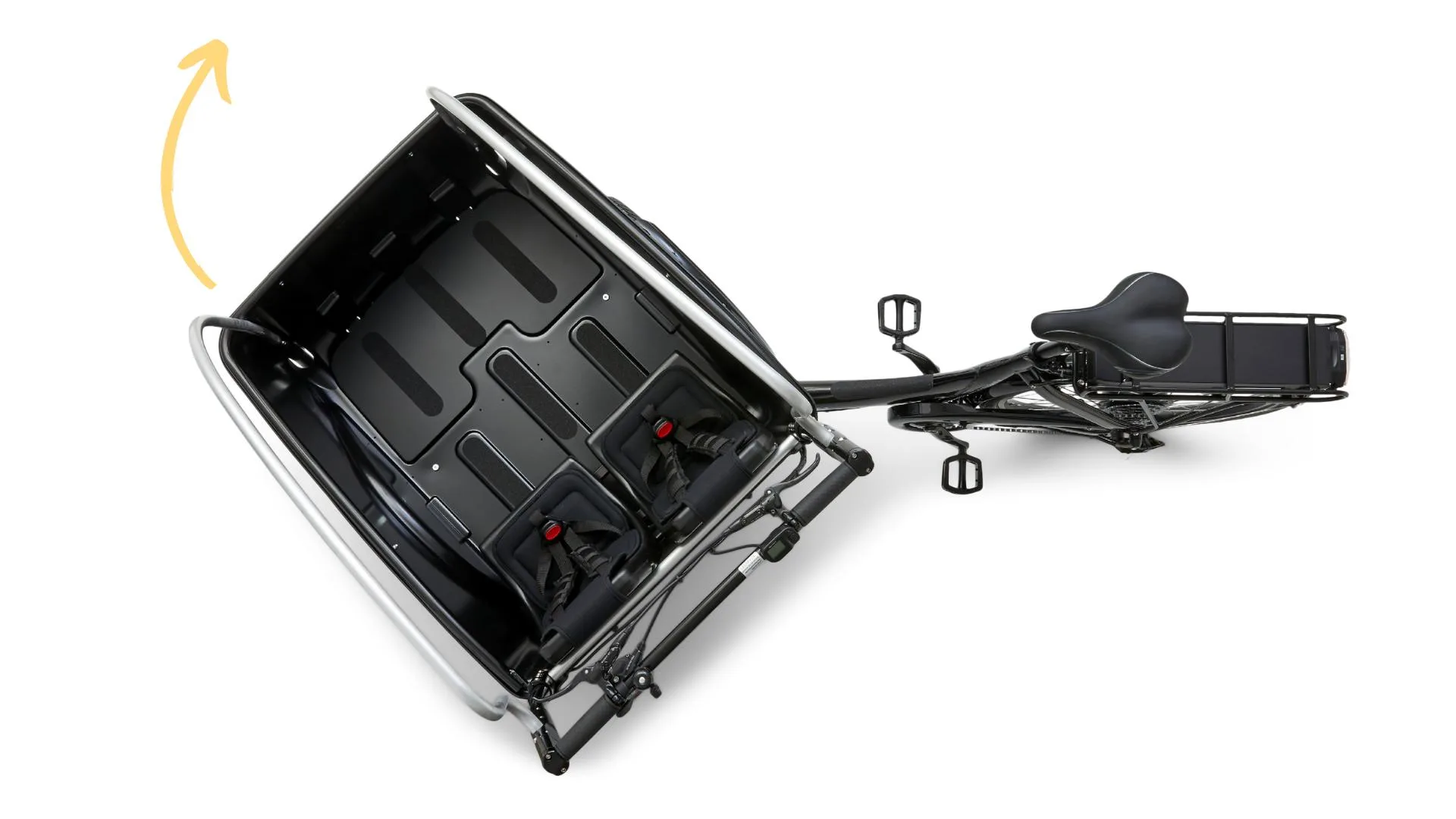 Ansicht von oben auf ein schwarzes Cargoo Lastenrad, das für den Transport von bis zu vier Kindern konzipiert ist. Die Kabine zeigt zwei Kindersitze mit Sicherheitsgurten.