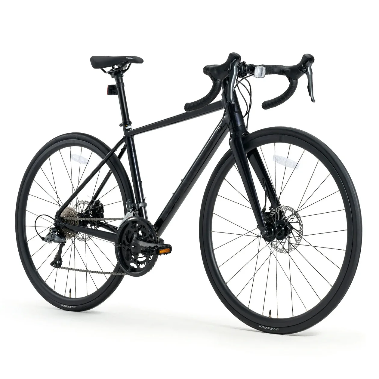 Schwarz lackiertes SPIN W2M Rennrad von der Seite betrachtet, mit Fokus auf Rahmen, Laufräder und Anbauteile.