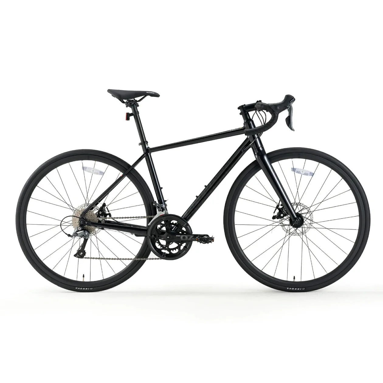 Seitliche Ansicht eines schwarzen SPIN W2M Rennrads mit Scheibenbremsen und einer Shimano Claris 2x8 Schaltung.